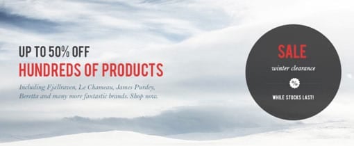 Advertisement banner showing a snowy landscape with text "UP TO 50% OFF HUNDREDS OF PRODUCTS" and a sale sticker for "winter clearance" mentioning brands like Fjallraven, Le Chameau, Purdey, Beretta, and others.