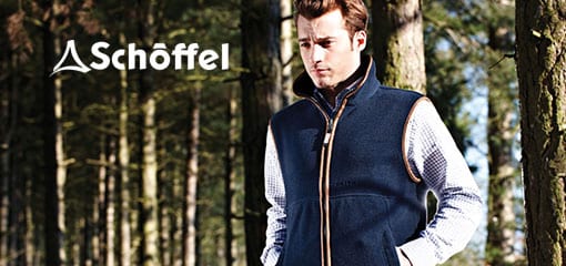 Man wearing a Schoffel fleece gilet standing in a forest, with the Schoffel logo above.