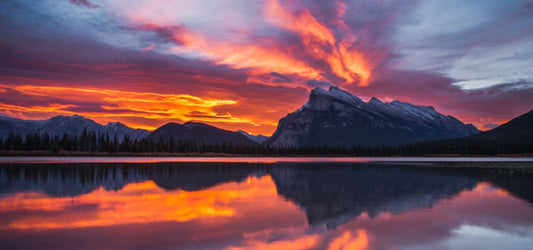 Red Sky Over Lake and Mountain Backdrop