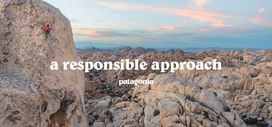 Man Climbing Rocky Peak in Mountainous Landscape Wearing Patagona Outdoor Gear